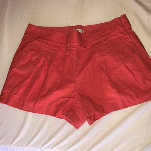 Coral high waisted shorts.